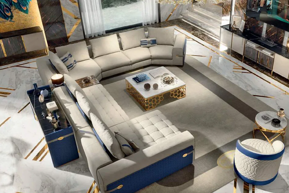 Avant Garde catalogue: cream sectional sofa with blue trim and a gold coffee table