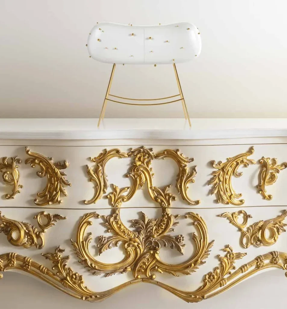 White chest with hand-carved gold ornaments