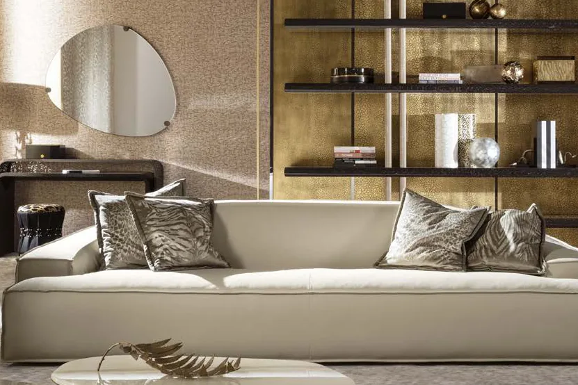 Roberto Cavalli catalogue: cream sofa with animal-print cushions