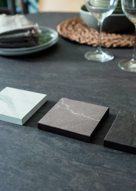 Marble and stone finish samples on a dining table