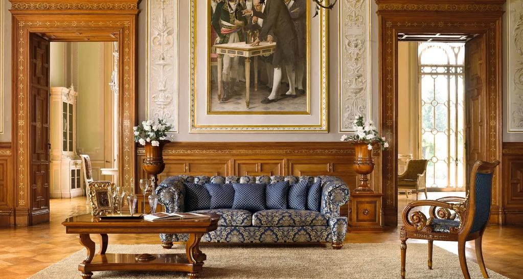 Senator catalogue: walnut-panelled salon with a blue damask sofa and carved coffee table
