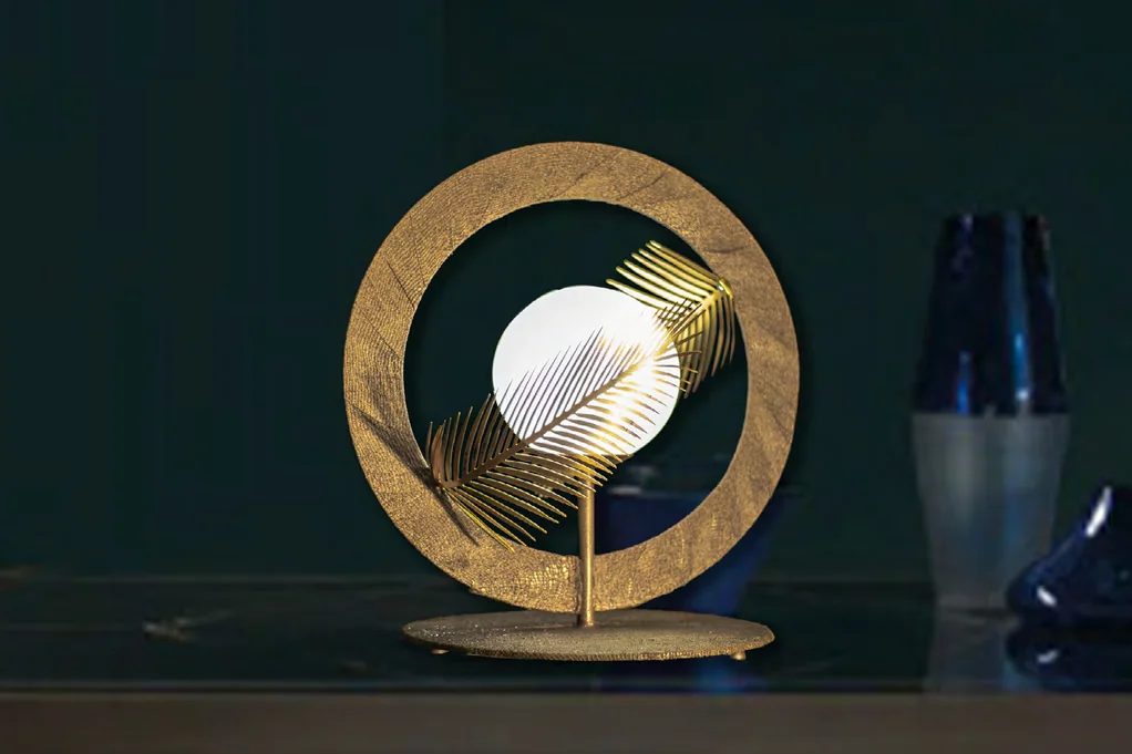 Contemporary Catalogue II: brass ring table lamp with a golden palm leaf and white globe
