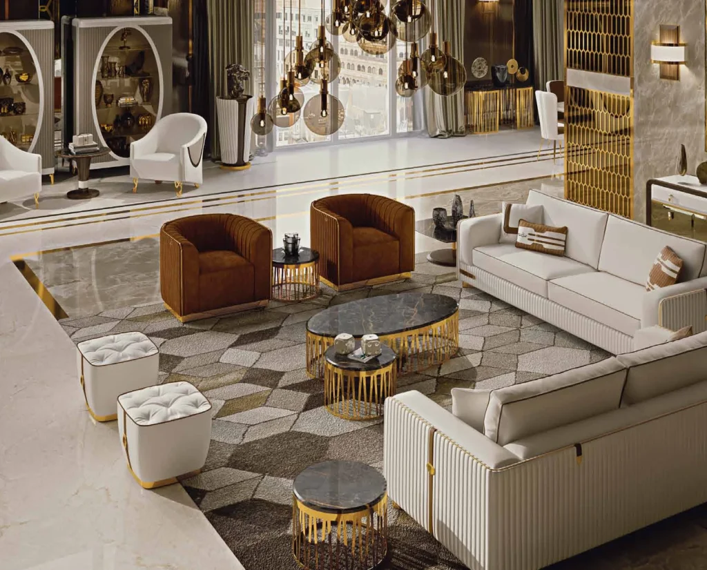 Lifestyle: living room with cream sofas, rust velvet armchairs and gold-based tables